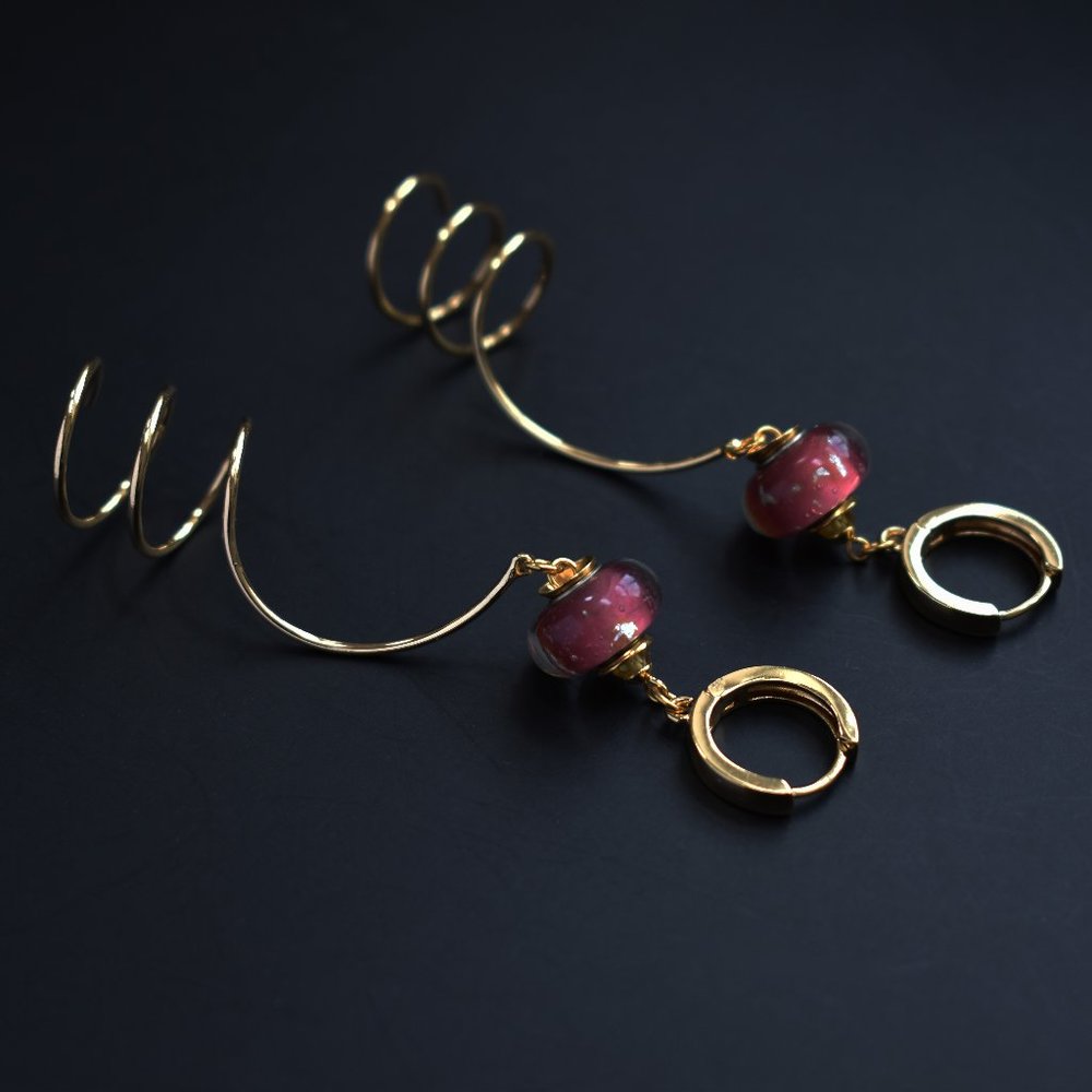 Unmatched earrings dangle, large spiral earrings gold tone